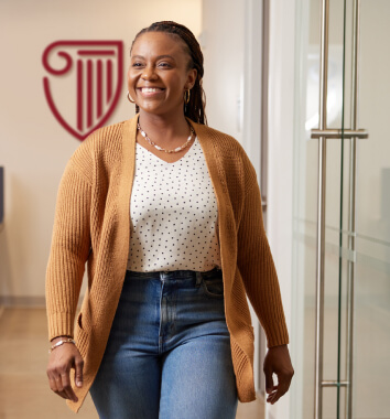 Smiling sweatered student strolling